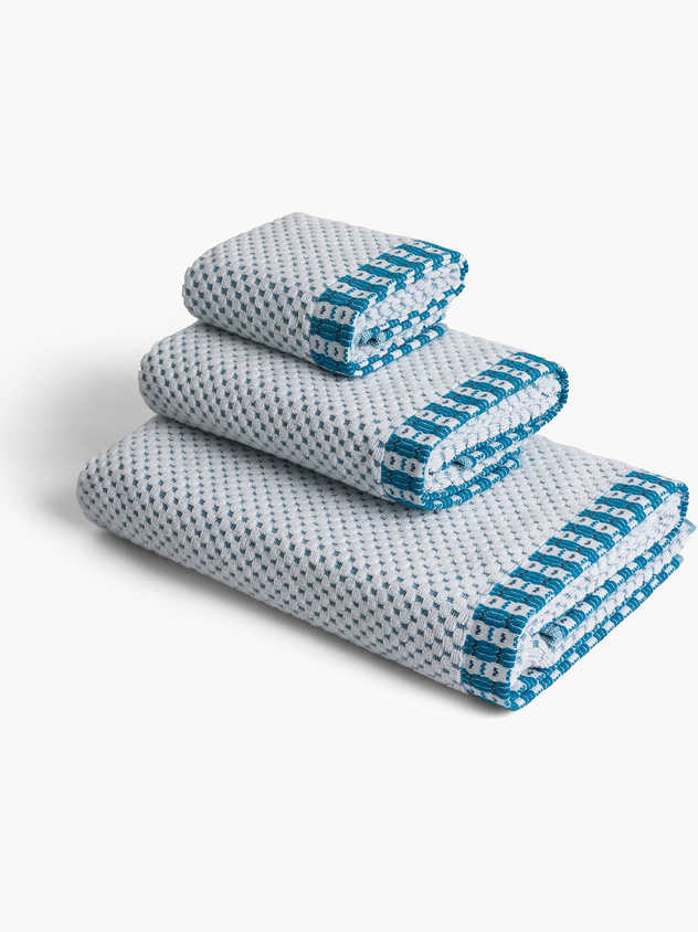 Asciugamano in cotone con lavorazione jacquard