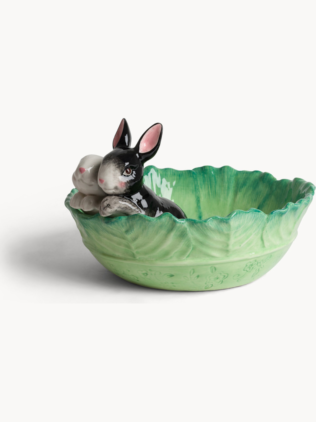 Leaf-shaped ceramic cup with applied rabbits