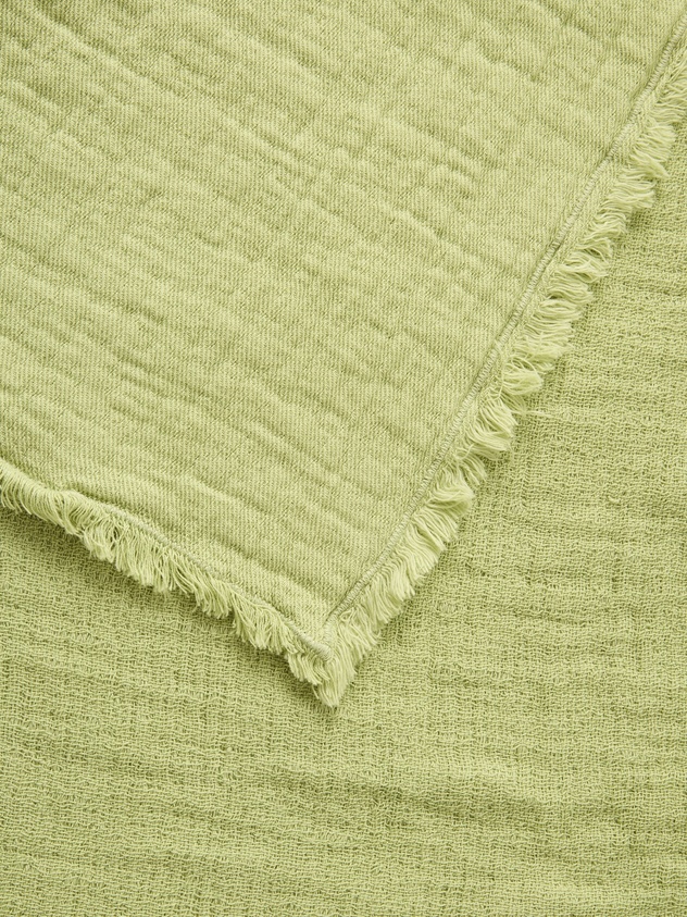 Solid-colored washed cotton gauze bedspread