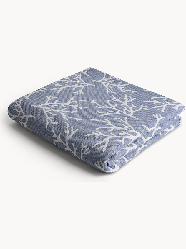 Bedspread with tone-on-tone workmanship.