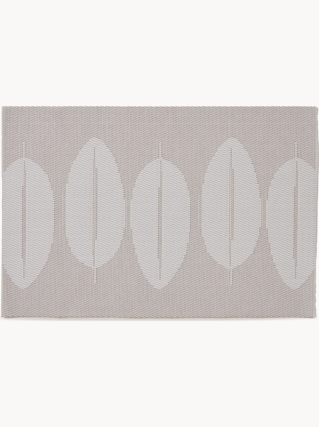 Woven plastic placemat with leaves