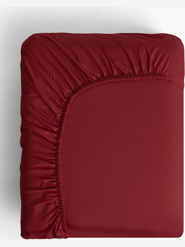 Solid-colored washed cotton sateen fitted sheet